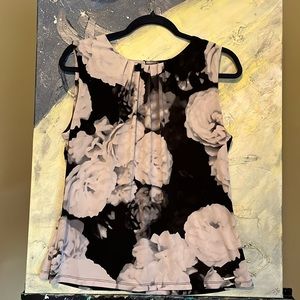 Sleeveless black and white blouse
